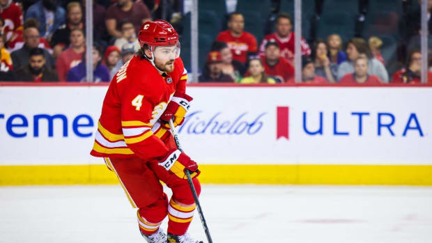Oct 20, 2022; Calgary, Alberta, CAN; Calgary Flames defenseman Rasmus Andersson (4) skates with the puck against the Buffalo Sabres during the first period at Scotiabank Saddledome. Mandatory Credit: Sergei Belski-USA TODAY Sports